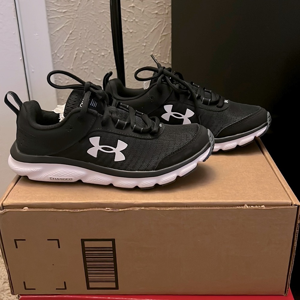 Brand new Under Armour charged running shoes w/box. Never worn in mint condition